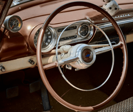 alt="Steering wheel of a 1953 Chevy Bel Air"