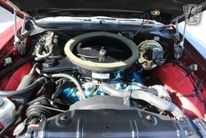 alt="Engine view of a 1970 Oldsmobile Cutlass"