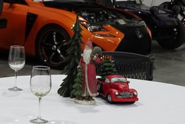 alt="Christmas theme table centerpiece with vehicles in the background"